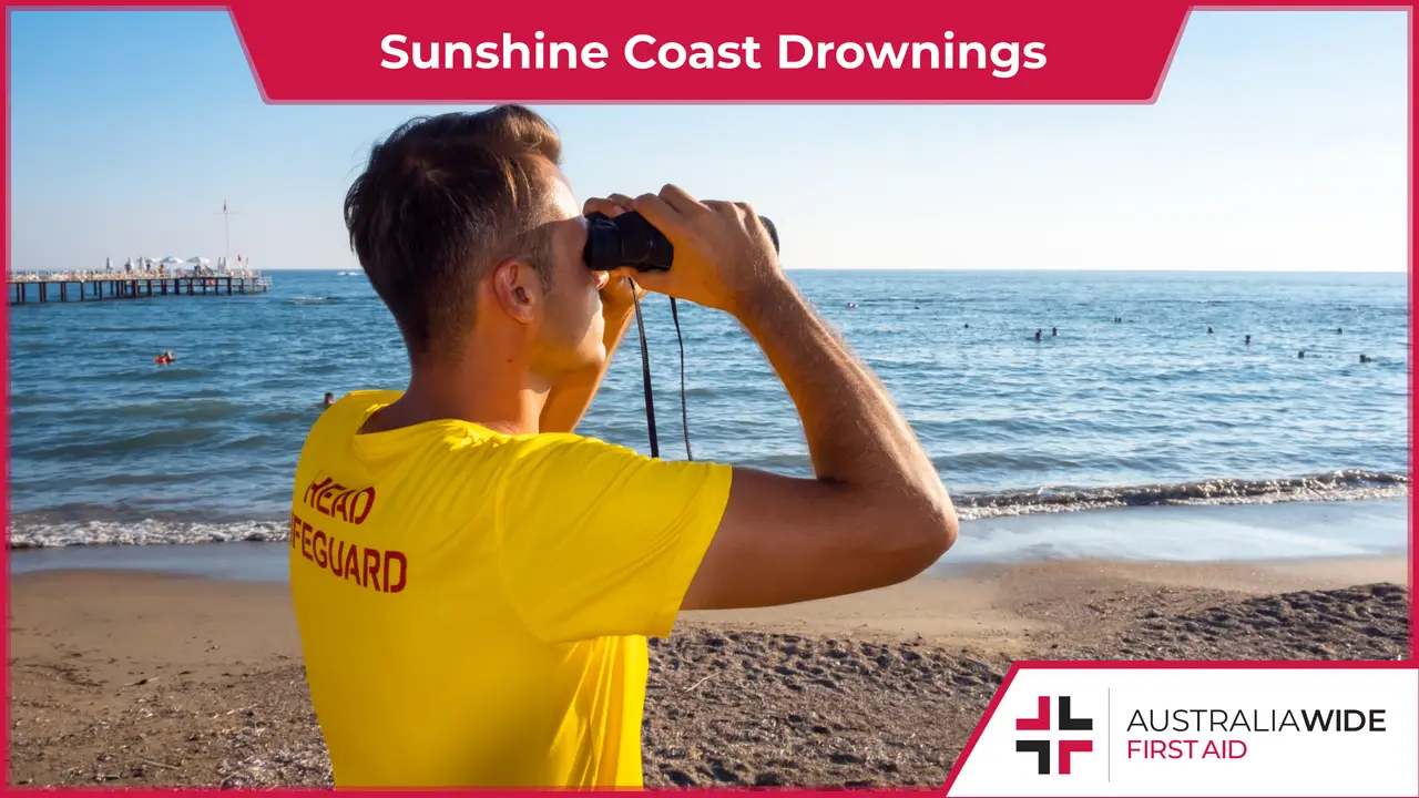 Male lifeguard patrolling beach